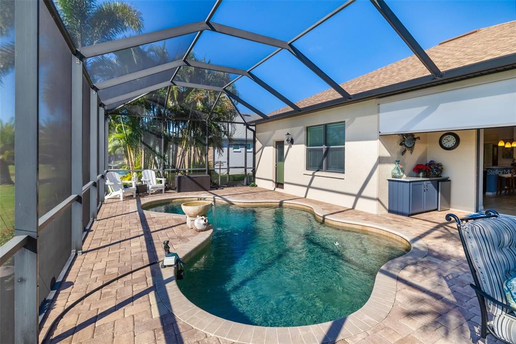 12844 24th St Circle East Parrish, FL 34219 - Photo 43 of 57 a view of a house with backyard porch and sitting area