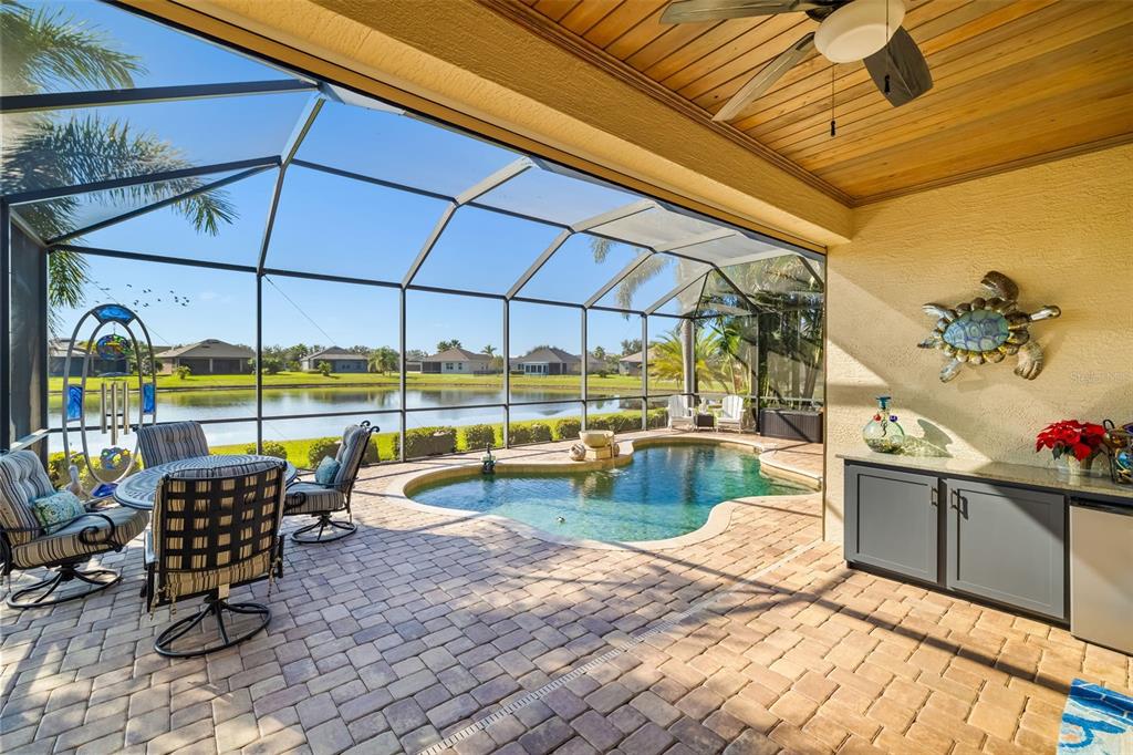 12844 24th St Circle East Parrish, FL 34219 - Photo 44 of 57 a view of a swimming pool with a lounge chairs