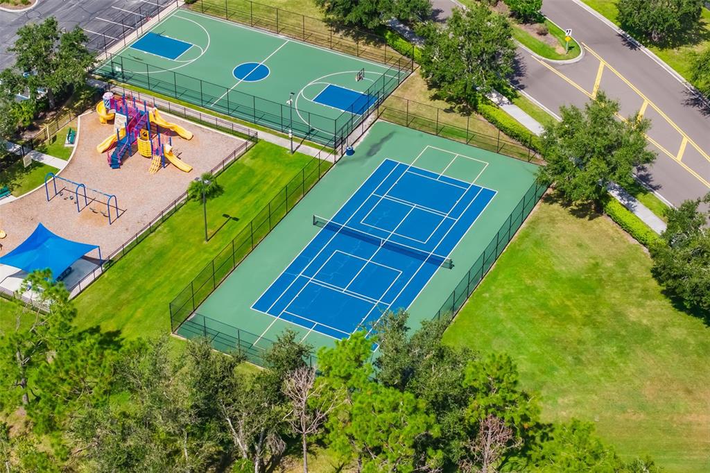 12844 24th St Circle East Parrish, FL 34219 - Photo 54 of 57 an aerial view of a tennis ground with a swimming pool