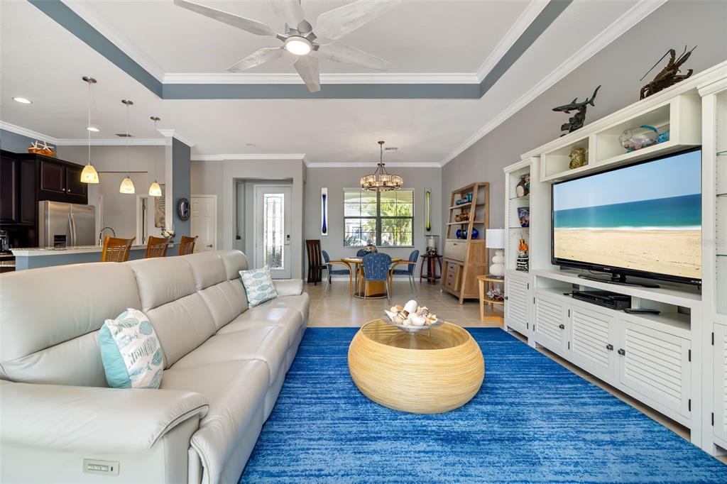12844 24th St Circle East Parrish, FL 34219 - Photo 6 of 57 a living room with furniture and a flat screen tv
