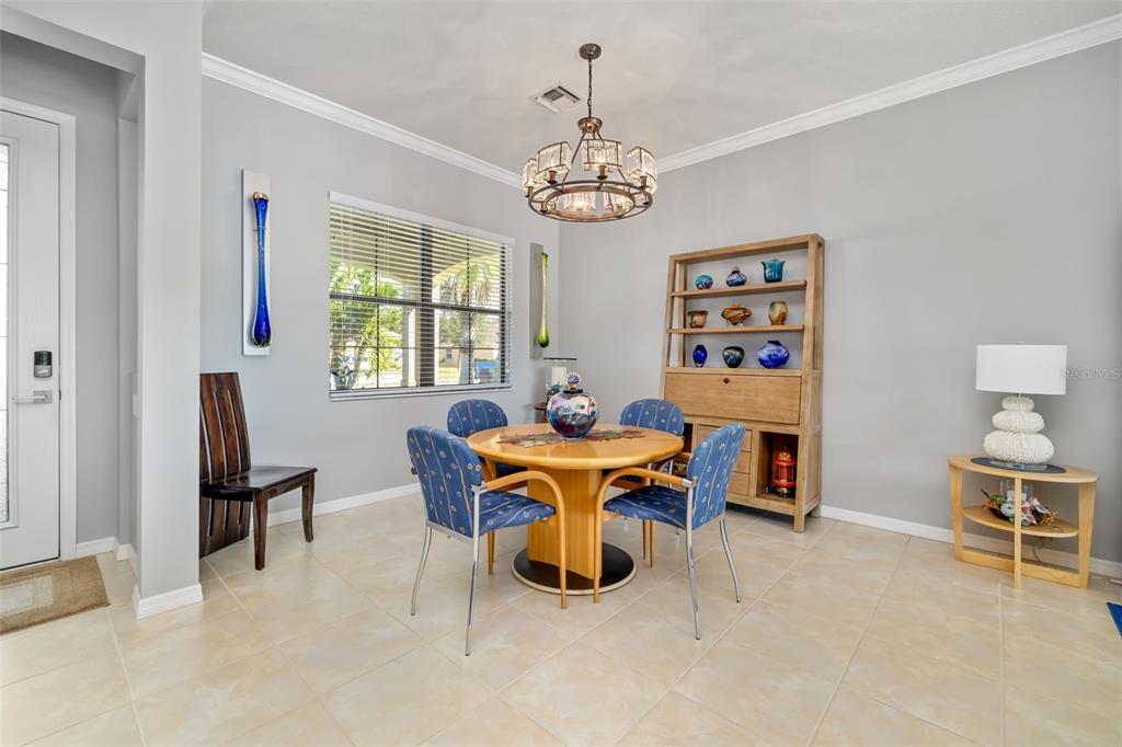 12844 24th St Circle East Parrish, FL 34219 - Photo 7 of 57 a view of a dining room with furniture window and outside view