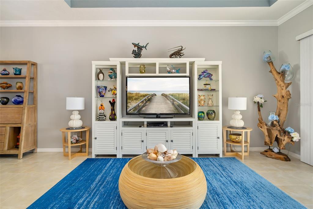 12844 24th St Circle East Parrish, FL 34219 - Photo 9 of 57 a room with furniture and a wooden floor