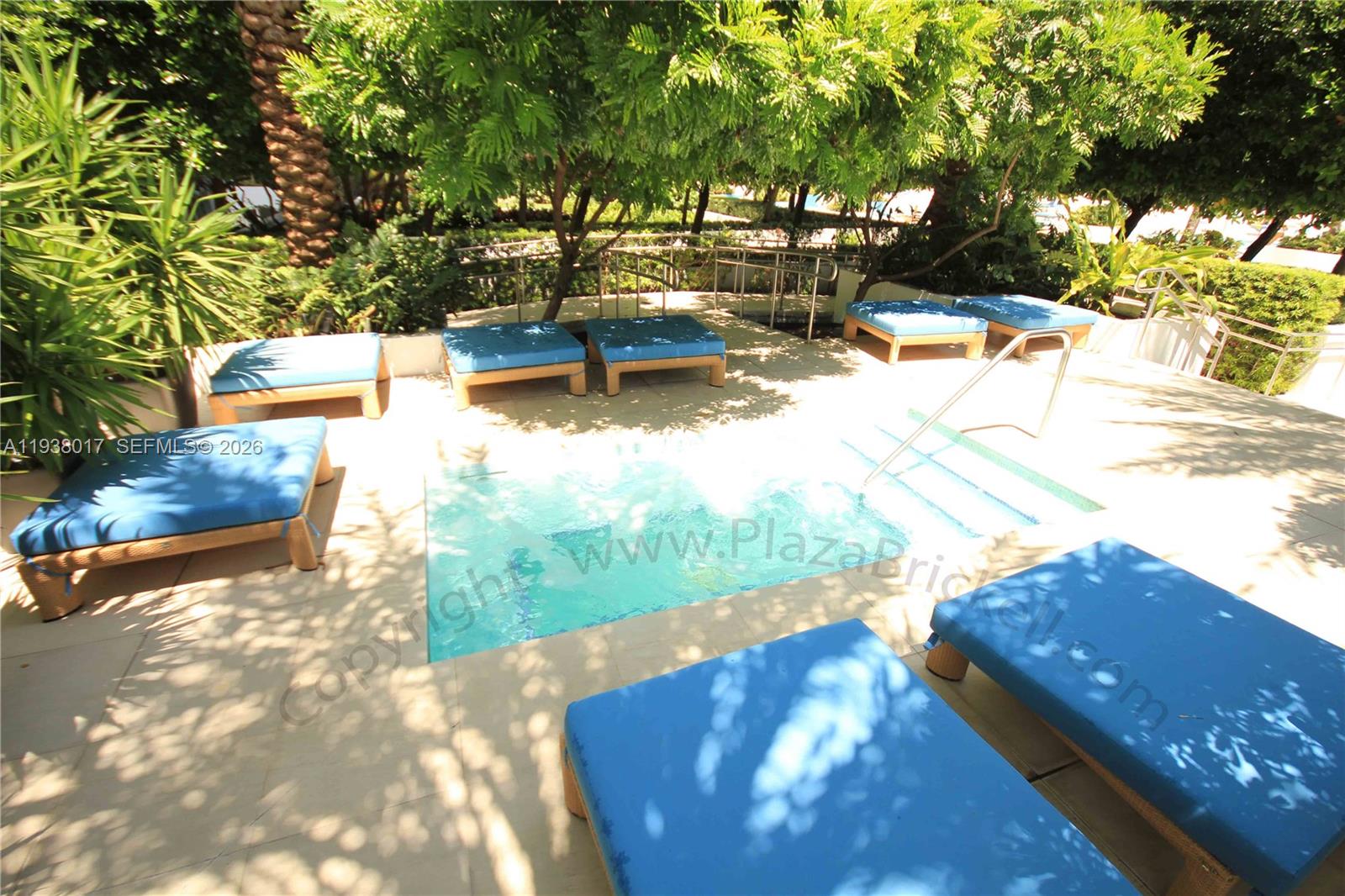 950 Brickell Bay Drive, Unit 5505 Miami, FL 33131 - Photo 47 of 63 a view of a swimming pool with a yard