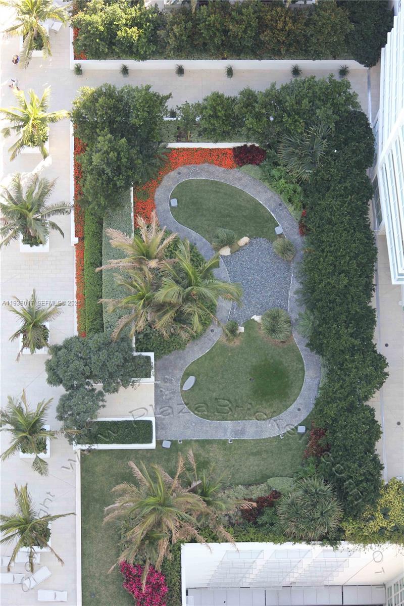 950 Brickell Bay Drive, Unit 5505 Miami, FL 33131 - Photo 49 of 63 an aerial view of a house with a yard and trees