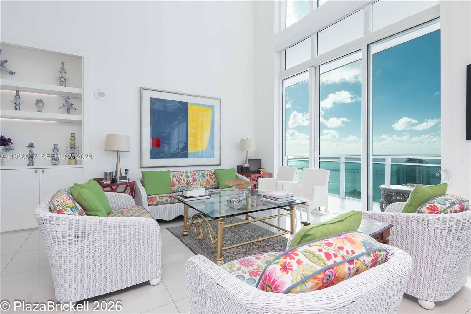 950 Brickell Bay Drive, Unit 5505 Miami, FL 33131 - Photo 5 of 63 a living room with furniture and a large window