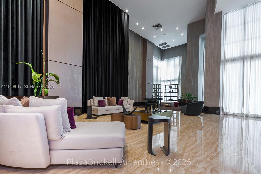 950 Brickell Bay Drive, Unit 5505 Miami, FL 33131 - Photo 53 of 63 a living room with furniture and large windows