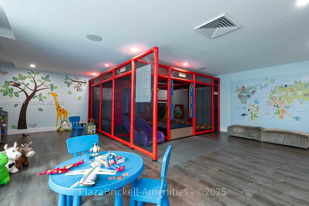 950 Brickell Bay Drive, Unit 5505 Miami, FL 33131 - Photo 60 of 63 a living room with furniture and wooden floor