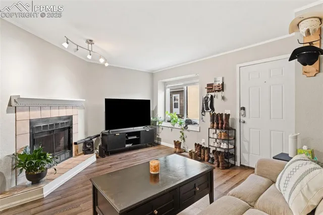 a living room with furniture and a flat screen tv
