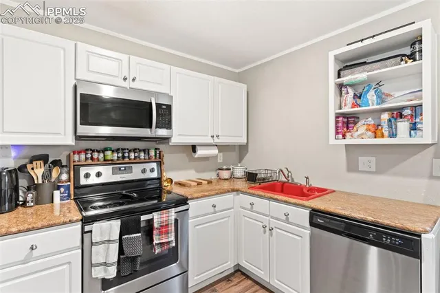 a kitchen with a stove and a microwave