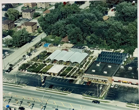 an aerial view of multiple houses with yard