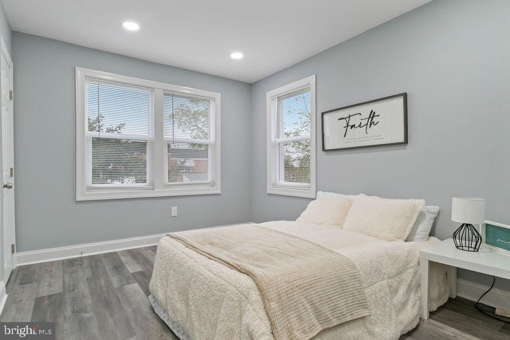 300 Denison Street Baltimore, MD 21229 - Photo 14 of 26 a bedroom with a bed and a window