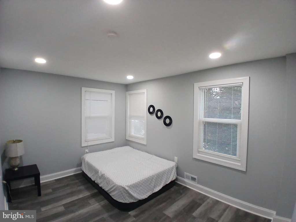 300 Denison Street Baltimore, MD 21229 - Photo 16 of 26 a bedroom with a bed and a window