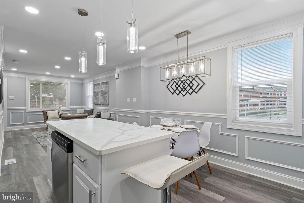 300 Denison Street Baltimore, MD 21229 - Photo 22 of 26 a very nice looking dining room with a table and chairs