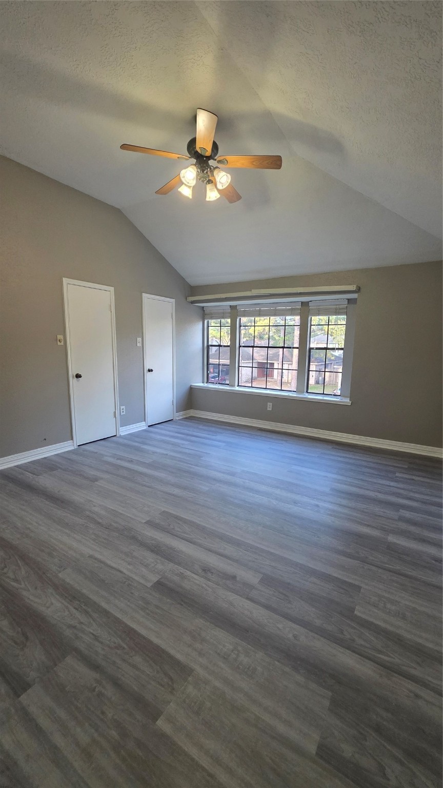16403 Salinas Lane Houston, TX 77095 - Photo 11 of 17 a view of an empty room with wooden floor and a window