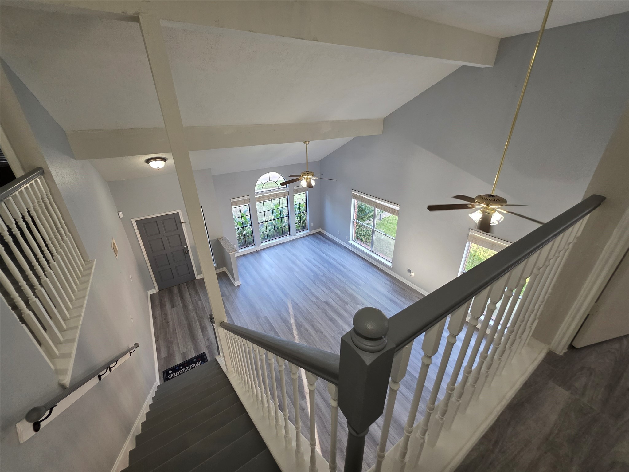 16403 Salinas Lane Houston, TX 77095 - Photo 7 of 17 a view of an entryway wooden floor and stairs