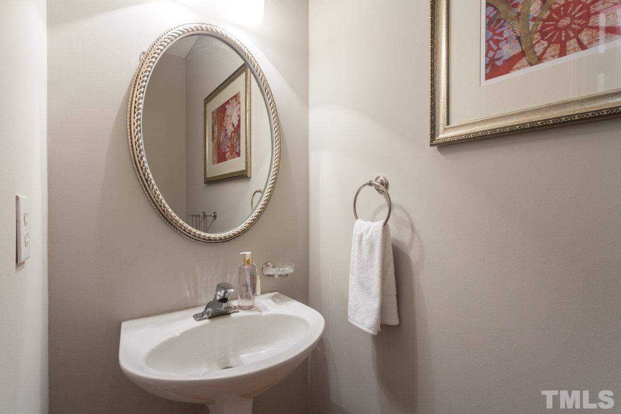 8523 Guerro Court Raleigh, NC 27613 - Photo 13 of 25 Powder room convenient yet tucked out of the way in back hallway.
