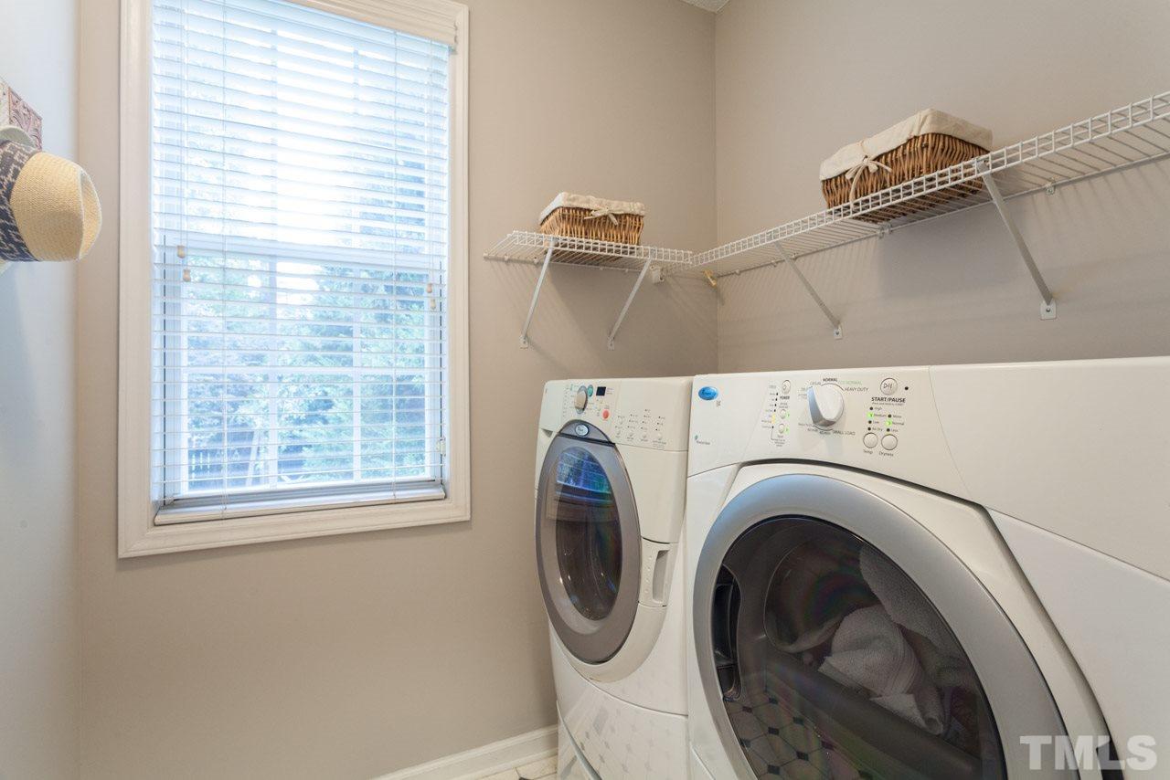 8523 Guerro Court Raleigh, NC 27613 - Photo 14 of 25 Laundry room has room for storage and a window to keep it brightly lit!