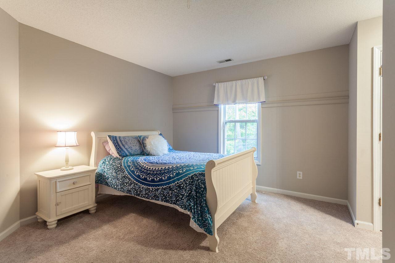 8523 Guerro Court Raleigh, NC 27613 - Photo 18 of 25 Second bedroom has great character and storage!