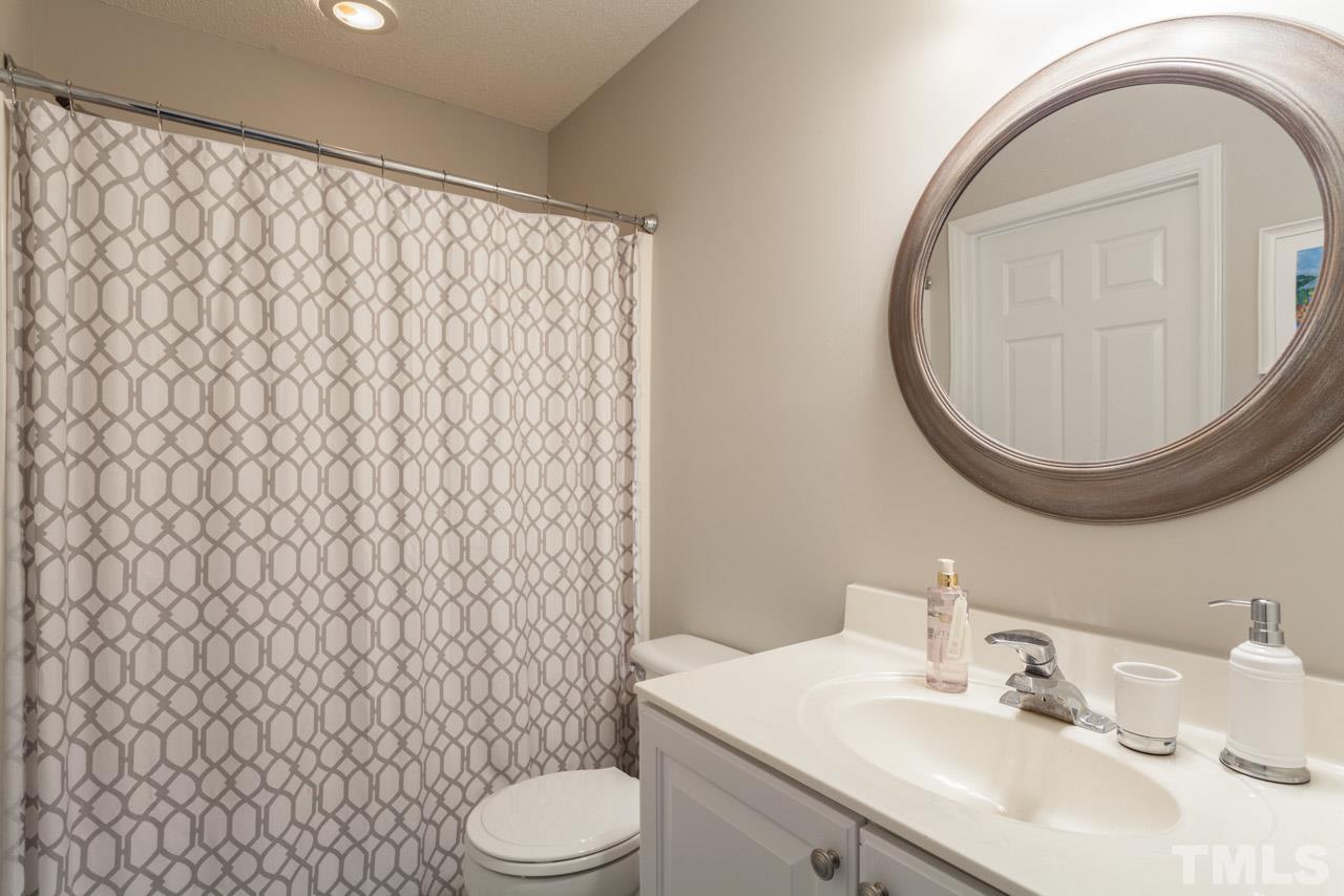 8523 Guerro Court Raleigh, NC 27613 - Photo 20 of 25 Upstairs full bath is a Jack and Jill style shared between the 2nd and 3rd bedrooms.