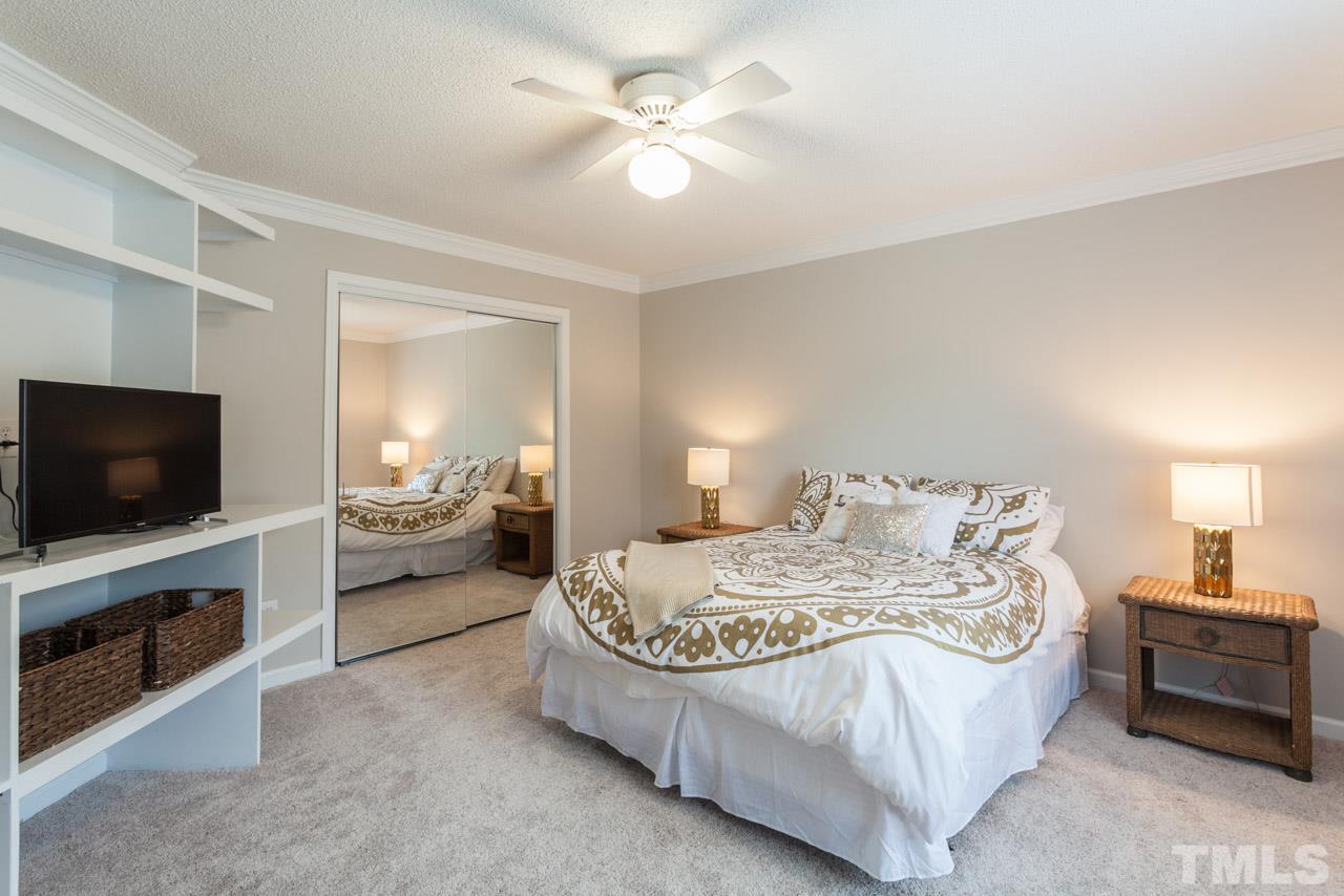 8523 Guerro Court Raleigh, NC 27613 - Photo 21 of 25 The fourth bedroom is very large and has great built in shelving. Can easily be used as a bonus room!