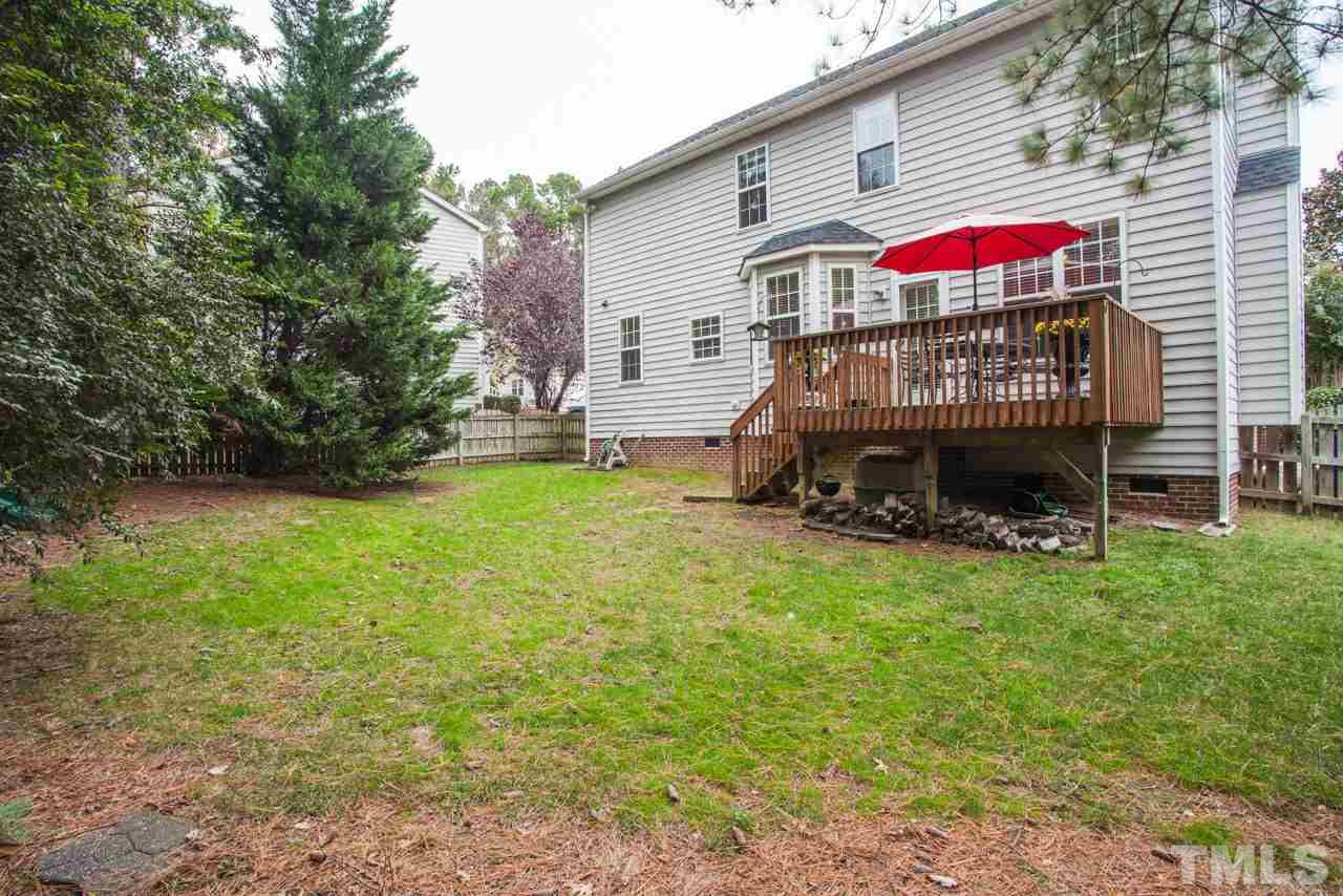8523 Guerro Court Raleigh, NC 27613 - Photo 23 of 25 Large backyard is fenced in and has space for play and for entertaining!