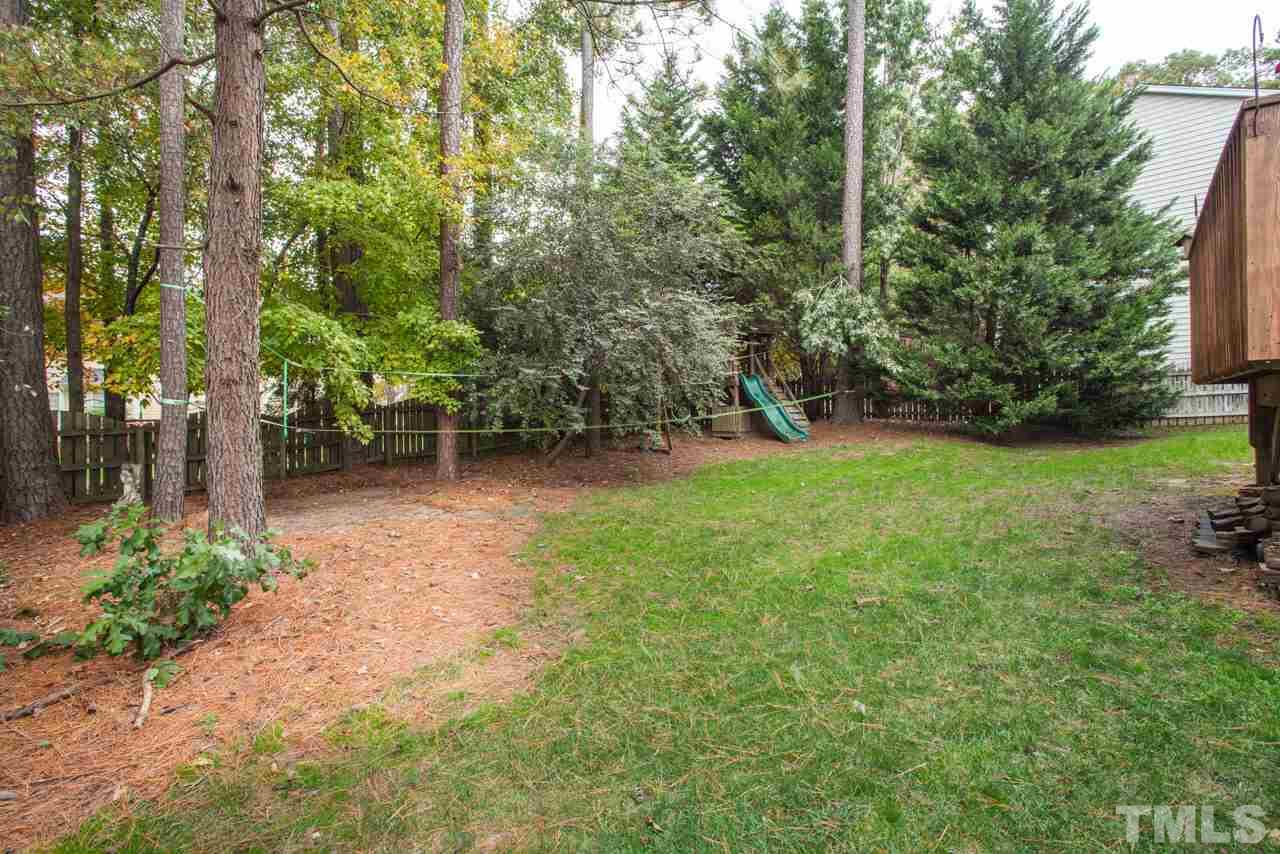 8523 Guerro Court Raleigh, NC 27613 - Photo 24 of 25 Backyard is fully fenced and has nice wooded buffer for privacy.