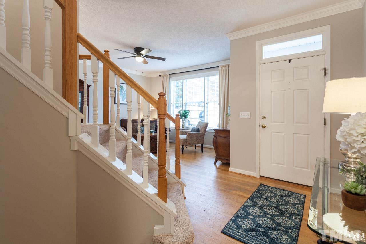8523 Guerro Court Raleigh, NC 27613 - Photo 4 of 25 Bright entry way leads to living & dining spaces with flexible use options.