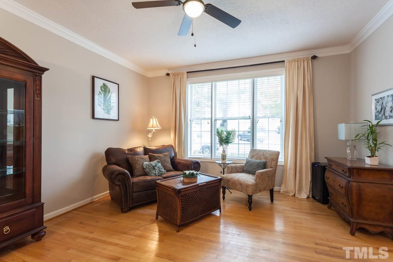 8523 Guerro Court Raleigh, NC 27613 - Photo 6 of 25 Living room area can be used for either casual or formal seating area, or as office nook.