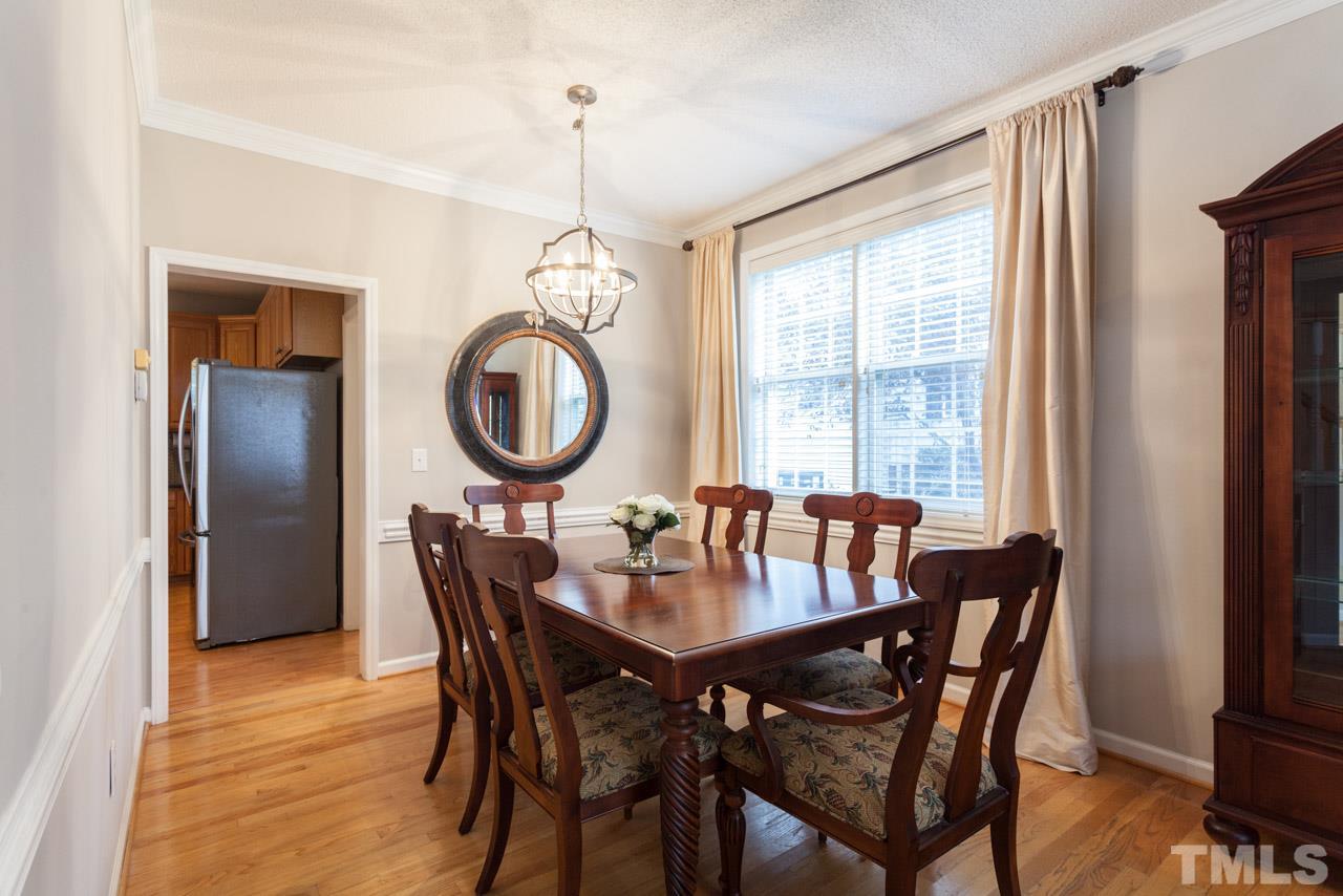 8523 Guerro Court Raleigh, NC 27613 - Photo 7 of 25 Beautifully lit dining room convenient to kitchen.