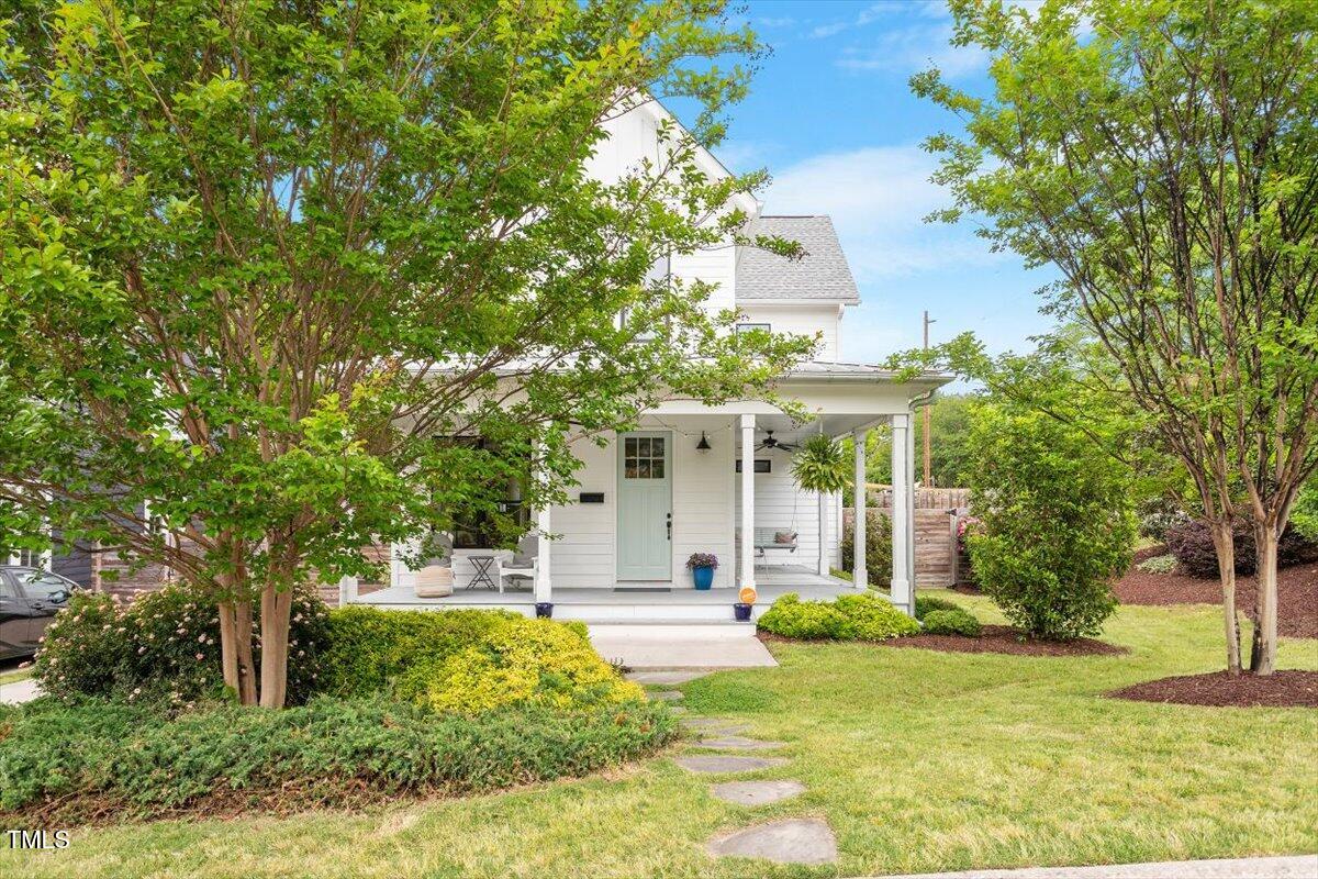 811 East Lane Street Raleigh, NC 27601 - Photo 32 of 35 Lush landscaping enhance the charm of this quintessential Carolina modern farm house.