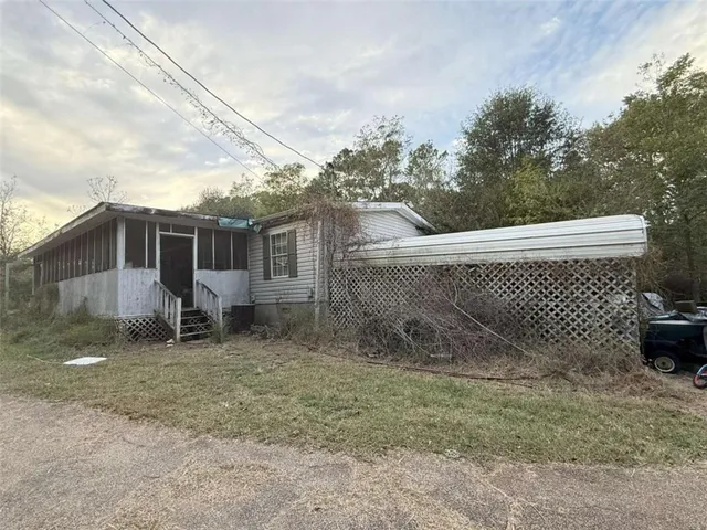 a backyard of a house with lots of green space