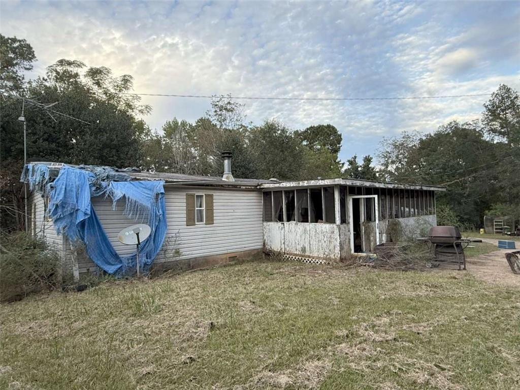 305 Zellner Road Culloden, GA 31016 - Photo 6 of 20 a backyard of a house with yard and trampoline