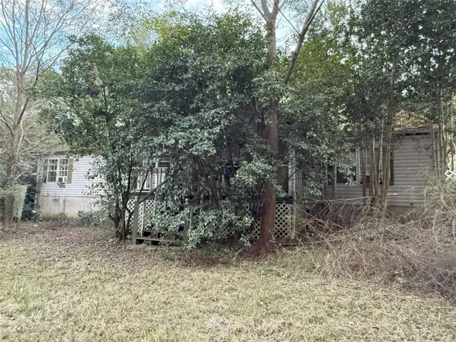 a view of a yard with a tree