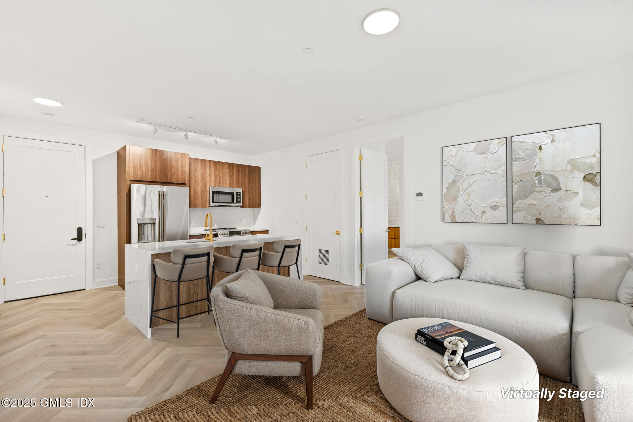 100 East Putnam Avenue, Unit 304 Cos Cob, CT 06807 - Photo 1 of 22 a living room with furniture and a large window