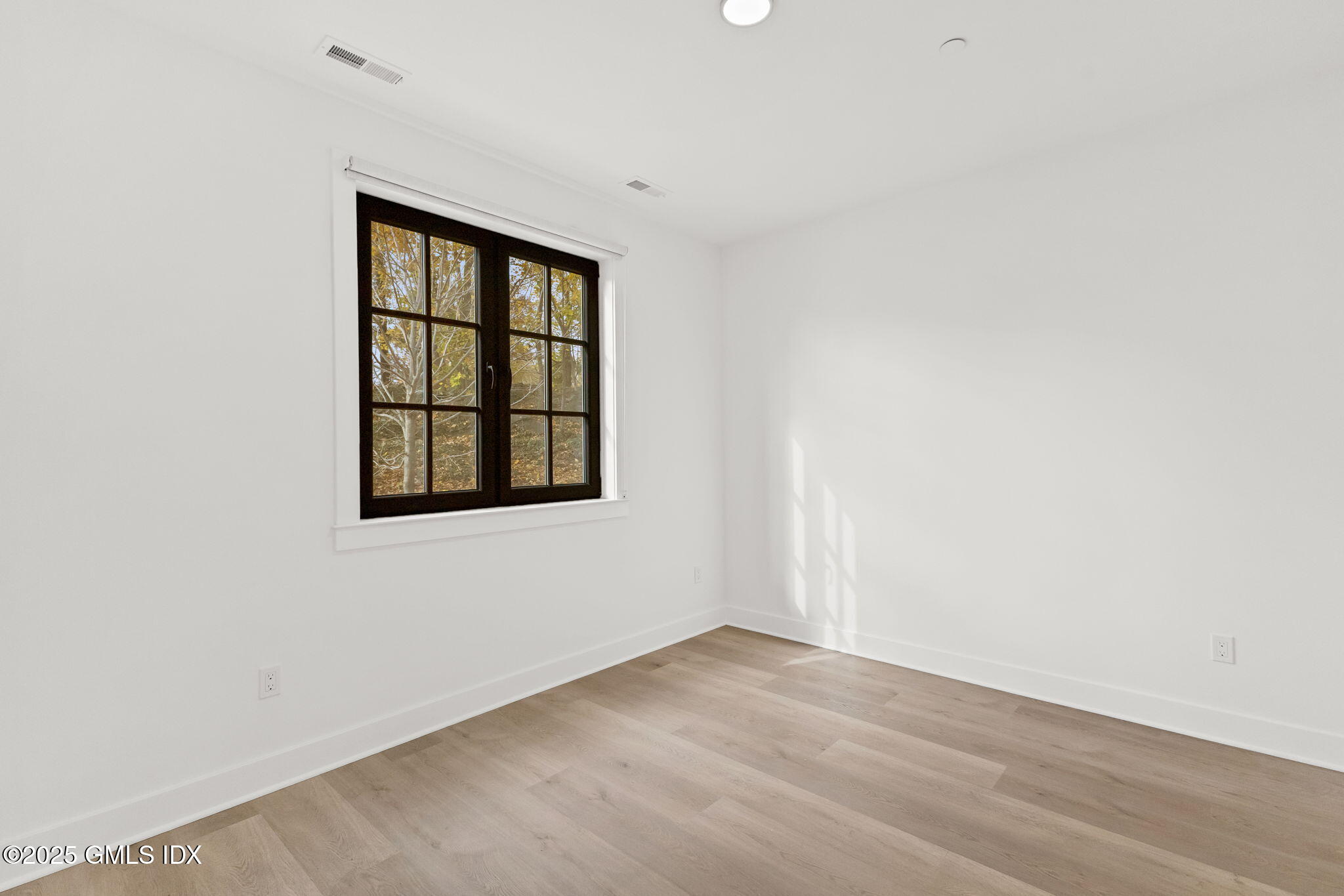 100 East Putnam Avenue, Unit 304 Cos Cob, CT 06807 - Photo 12 of 22 a view of an empty room with a window