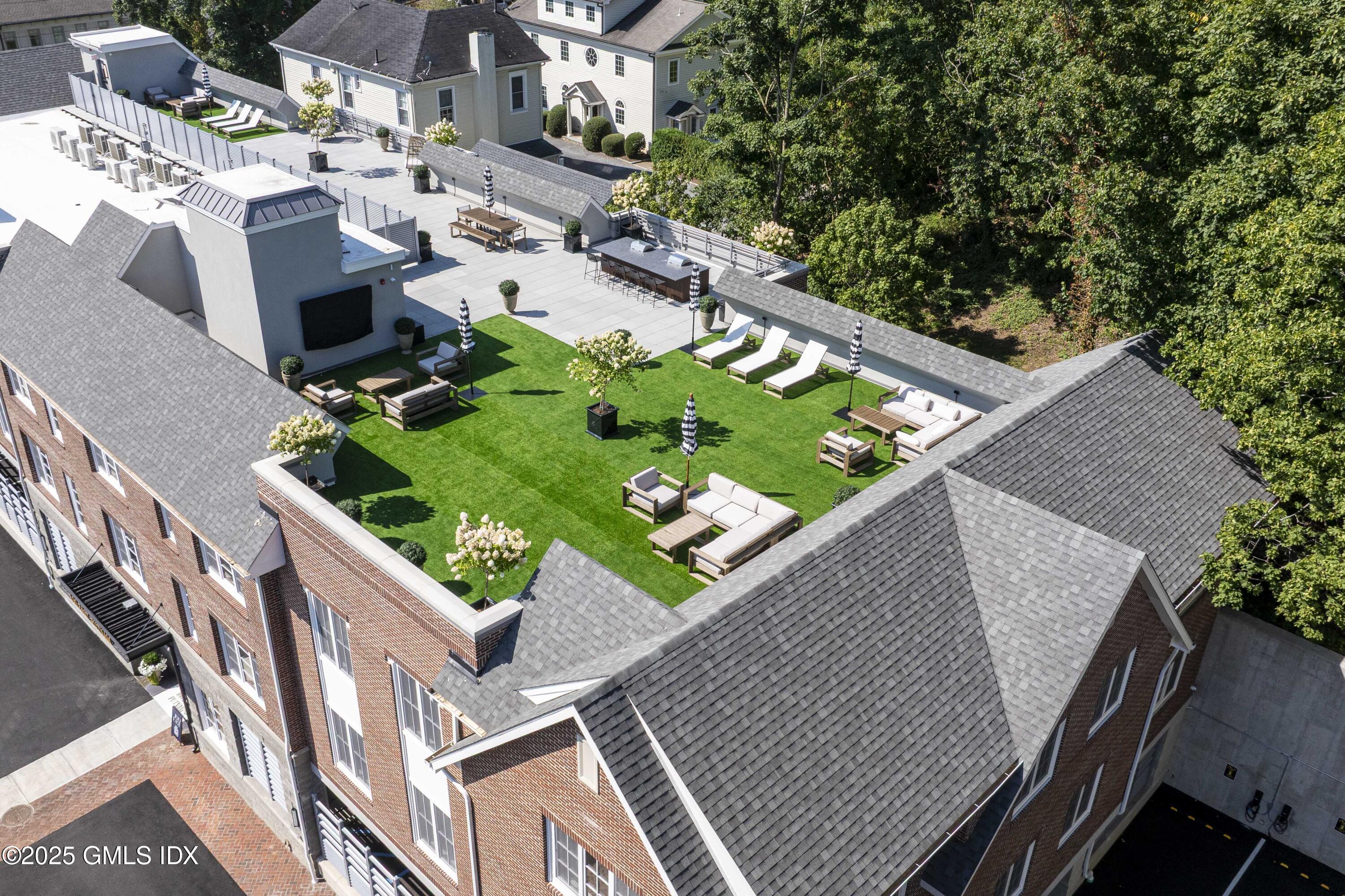 100 East Putnam Avenue, Unit 304 Cos Cob, CT 06807 - Photo 17 of 22 an aerial view of house with yard