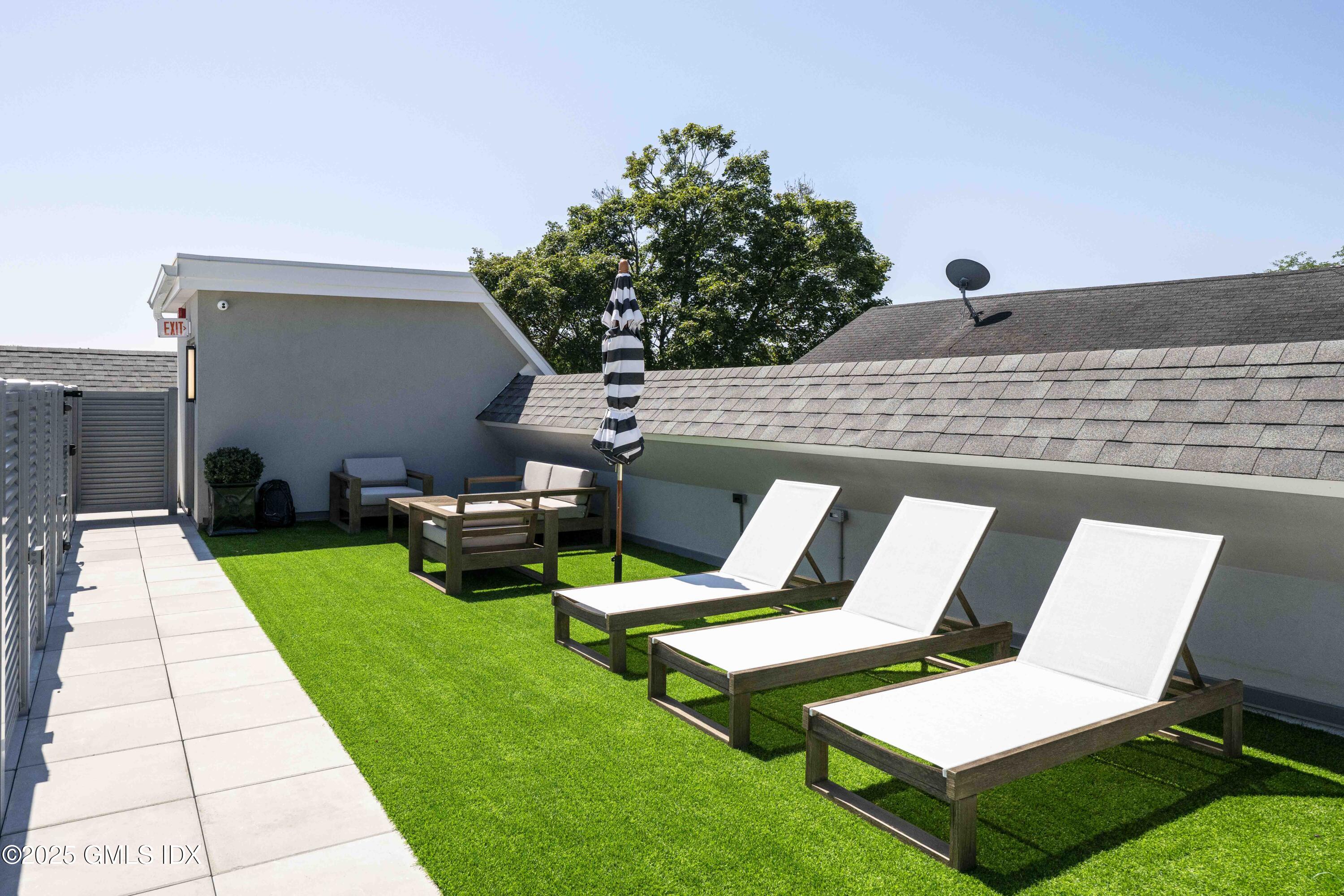 100 East Putnam Avenue, Unit 304 Cos Cob, CT 06807 - Photo 19 of 22 a view of backyard with sitting area