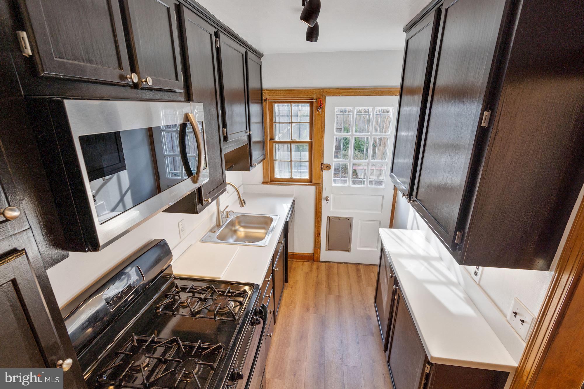 1403 K Street Southeast Washington, DC 20003 - Photo 11 of 74 a living room with furniture and a fireplace