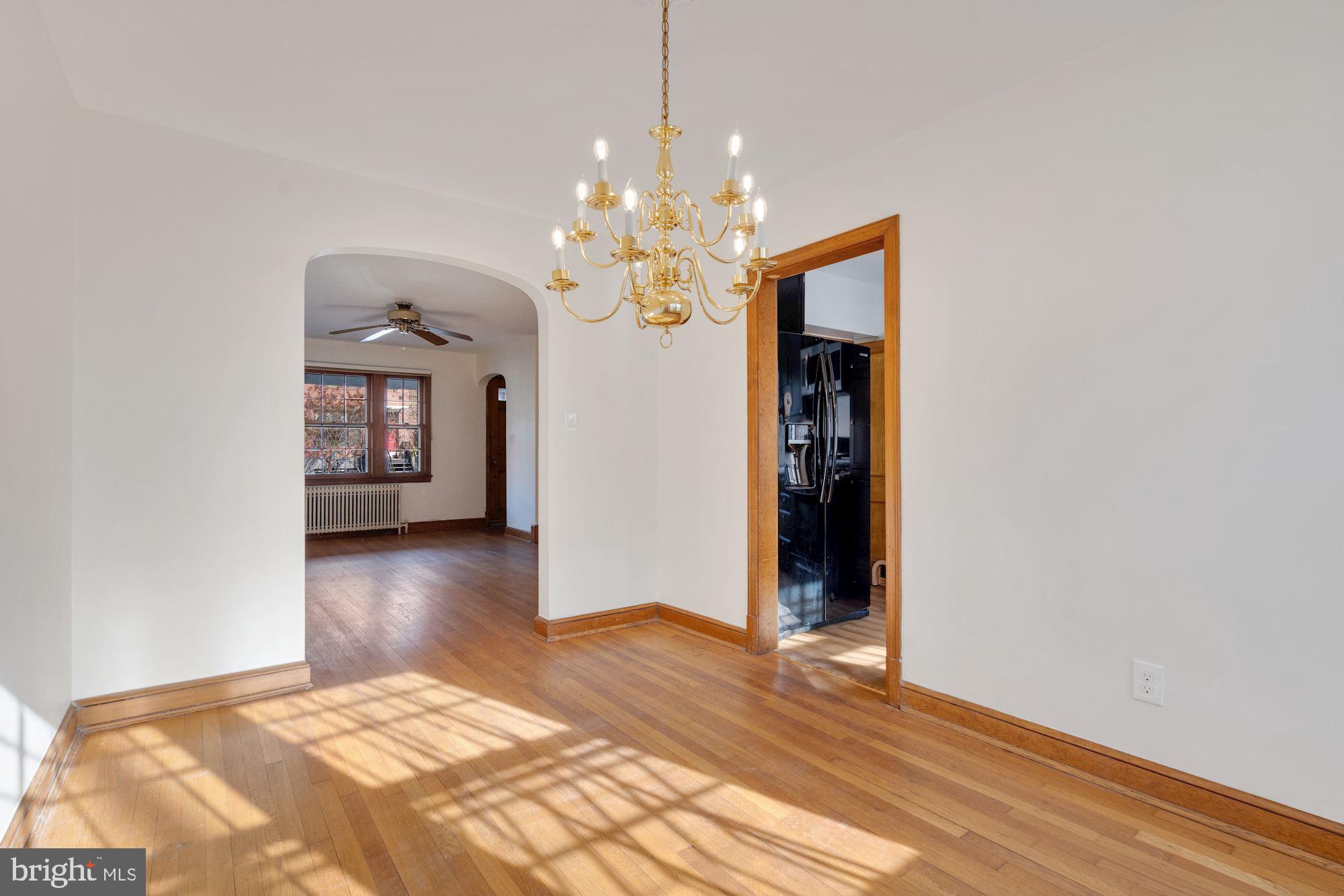 1403 K Street Southeast Washington, DC 20003 - Photo 15 of 74 a bedroom with a bed and a chandelier