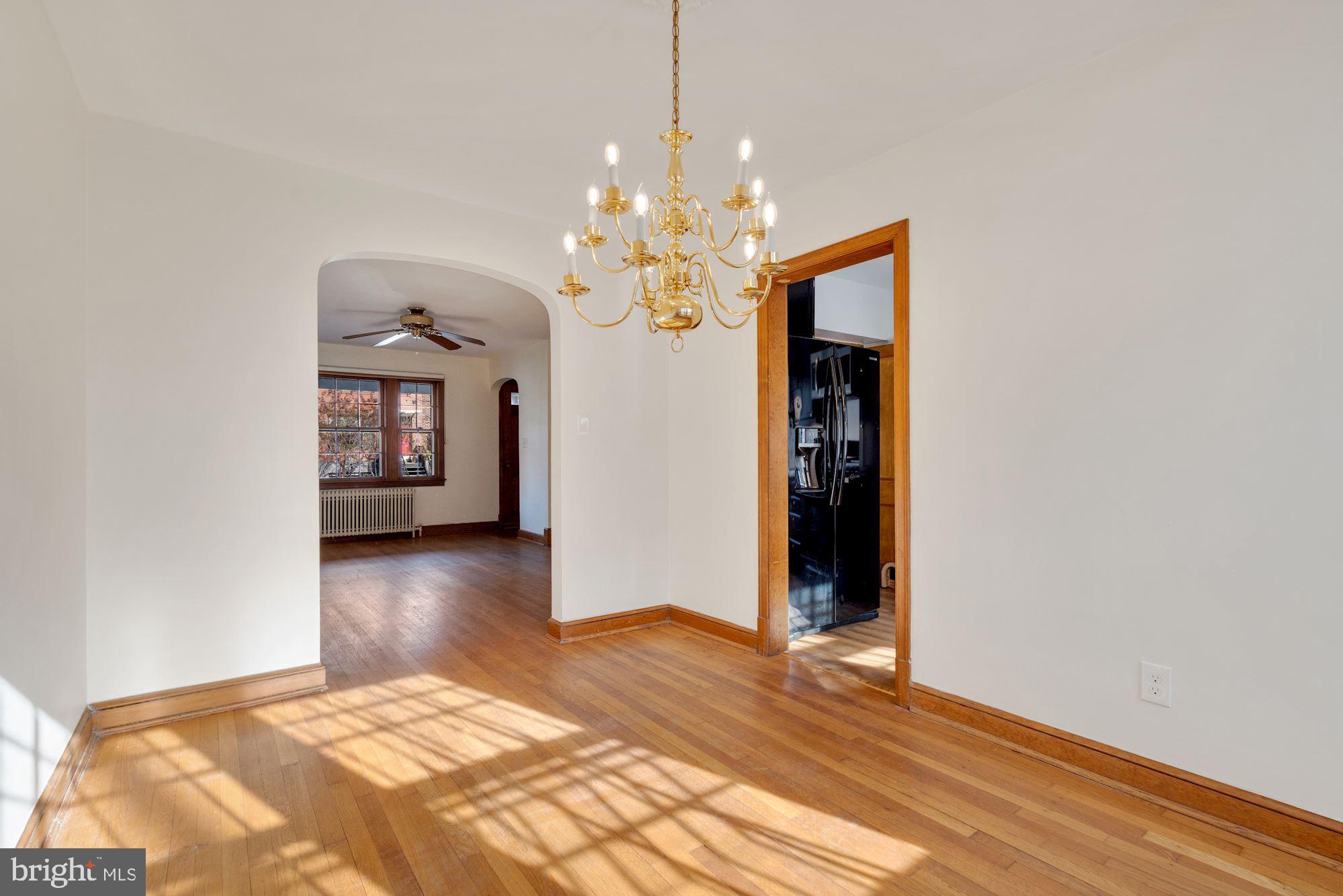 1403 K Street Southeast Washington, DC 20003 - Photo 17 of 74 a bedroom with a bed and a chandelier