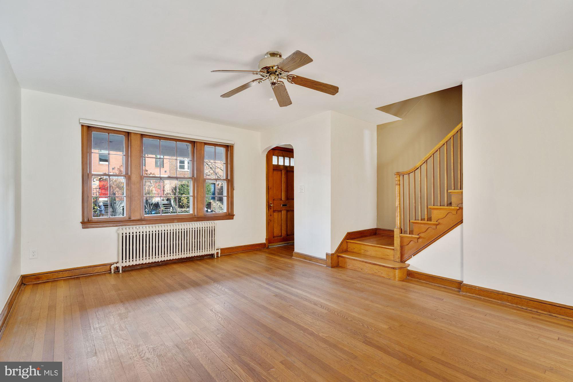 1403 K Street Southeast Washington, DC 20003 - Photo 21 of 74 a view of an empty room with window and wooden floor