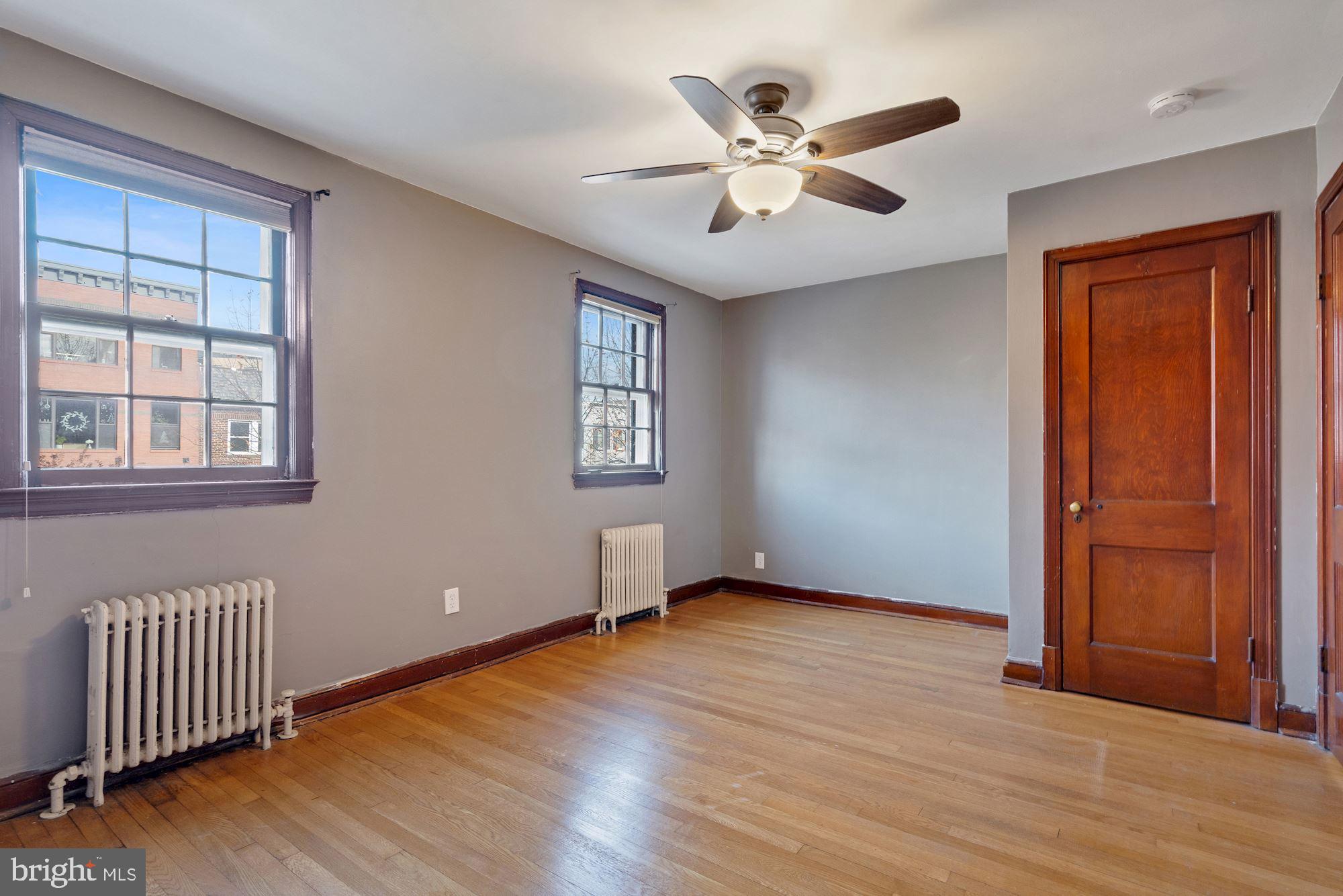 1403 K Street Southeast Washington, DC 20003 - Photo 26 of 74 wooden floor in an empty room with a window