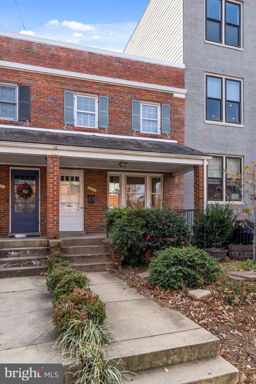 1403 K Street Southeast Washington, DC 20003 - Photo 38 of 74 front view of a brick house with potted plants