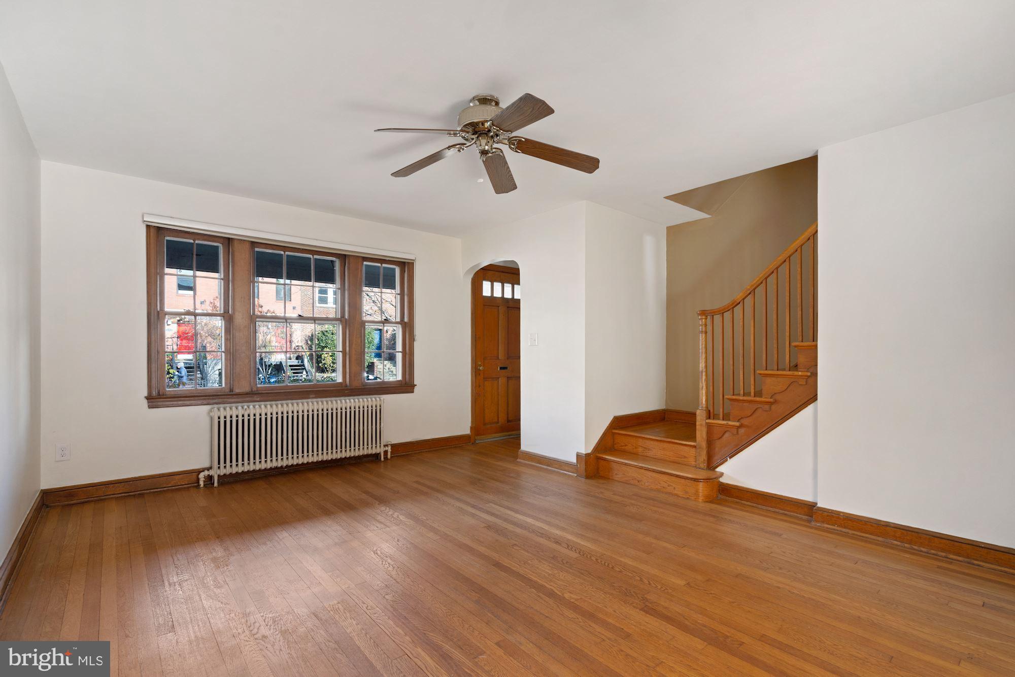 1403 K Street Southeast Washington, DC 20003 - Photo 58 of 74 a view of an empty room with wooden floor and a window