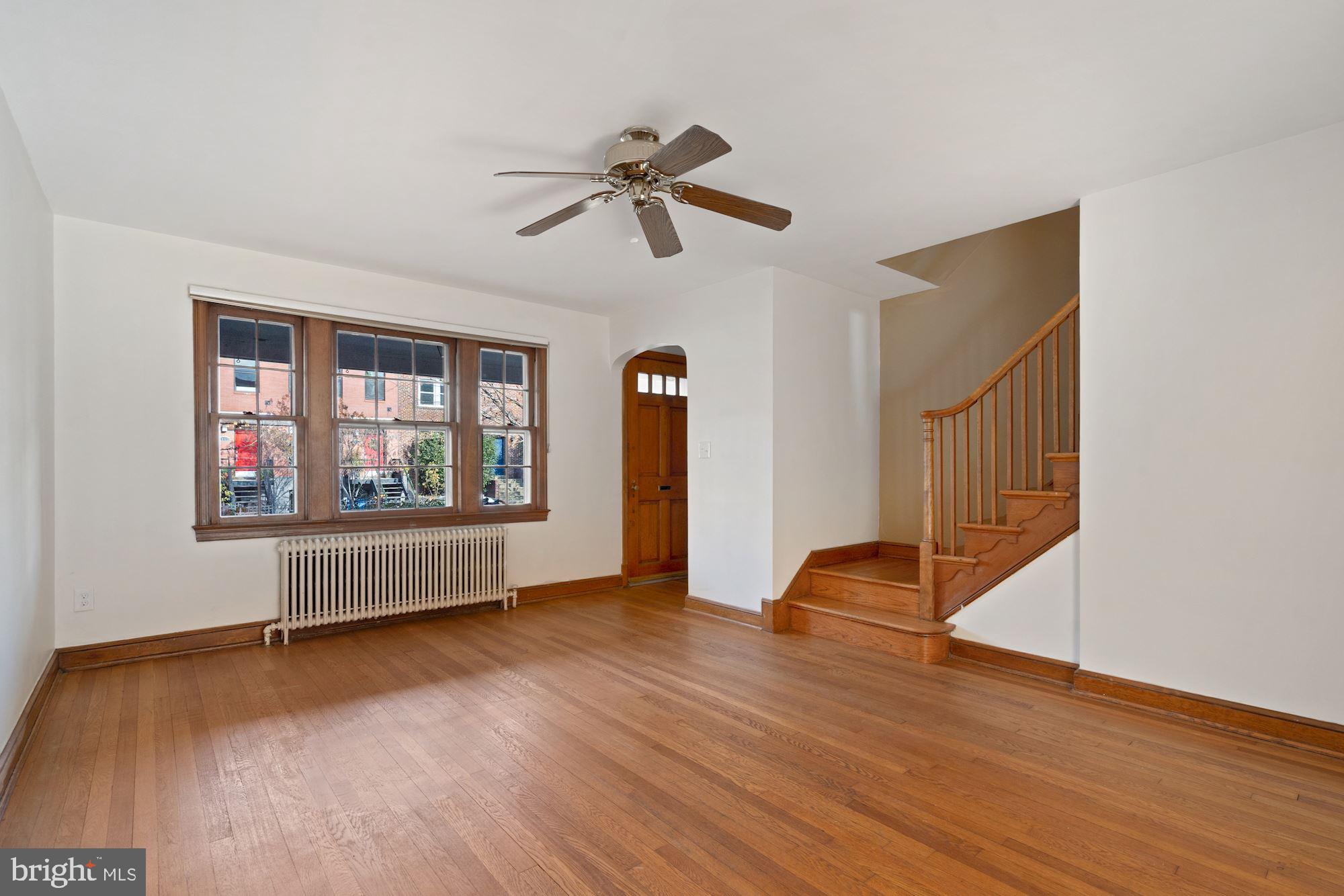 1403 K Street Southeast Washington, DC 20003 - Photo 59 of 74 a view of an empty room with wooden floor and a window