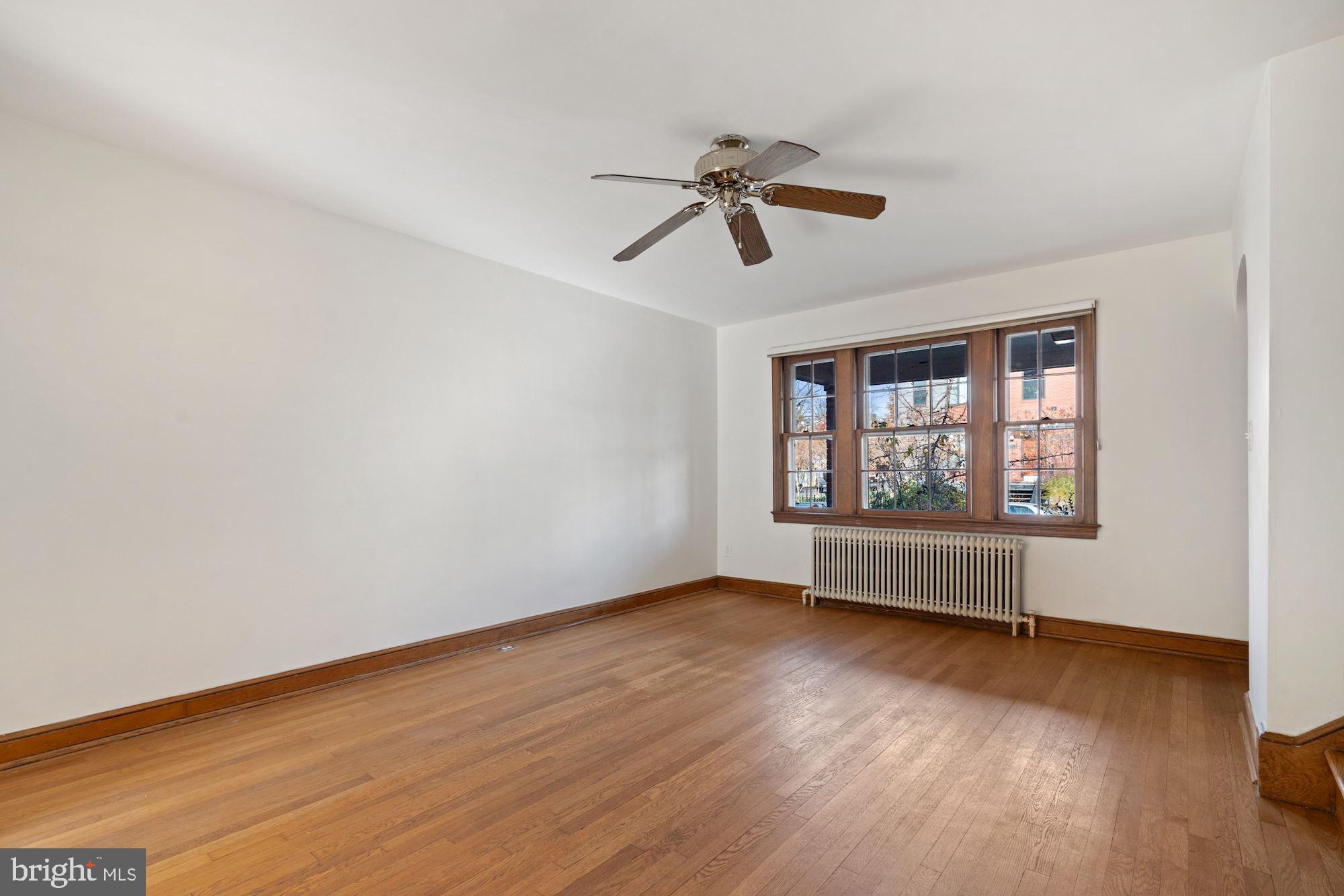 1403 K Street Southeast Washington, DC 20003 - Photo 60 of 74 a view of an empty room with wooden floor and a window