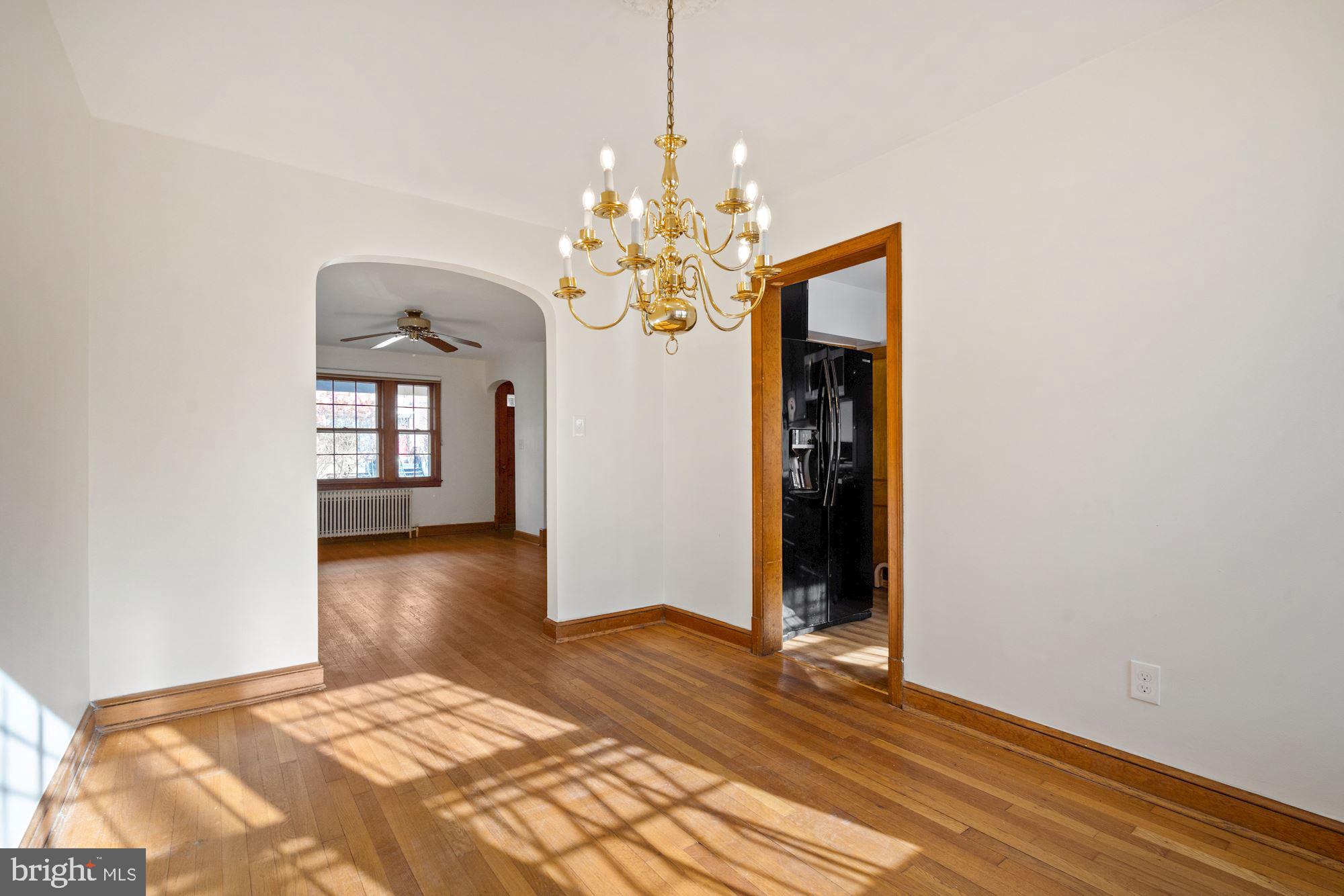 1403 K Street Southeast Washington, DC 20003 - Photo 63 of 74 a bedroom with a bed and a chandelier
