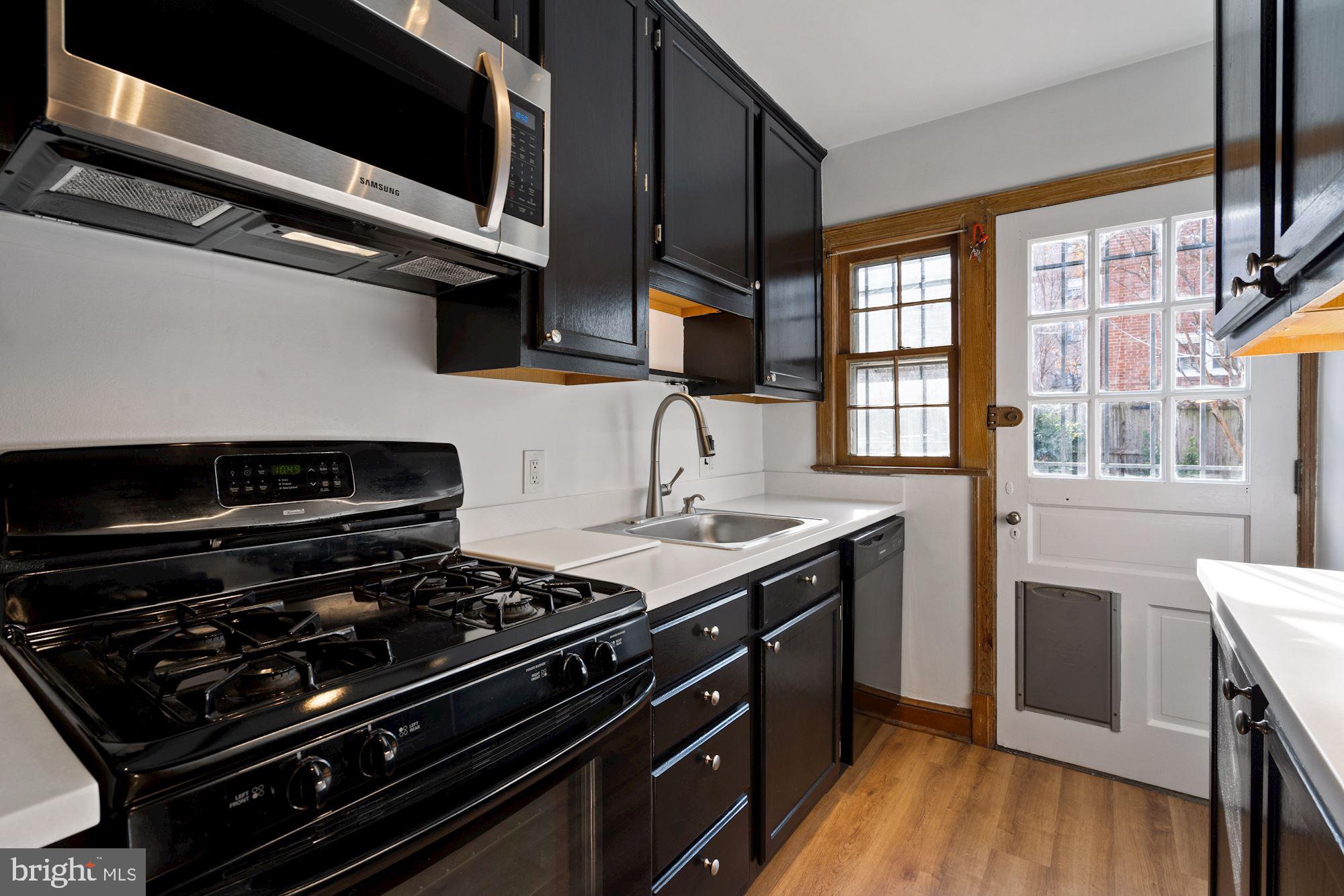 1403 K Street Southeast Washington, DC 20003 - Photo 64 of 74 a kitchen with a stove and a microwave