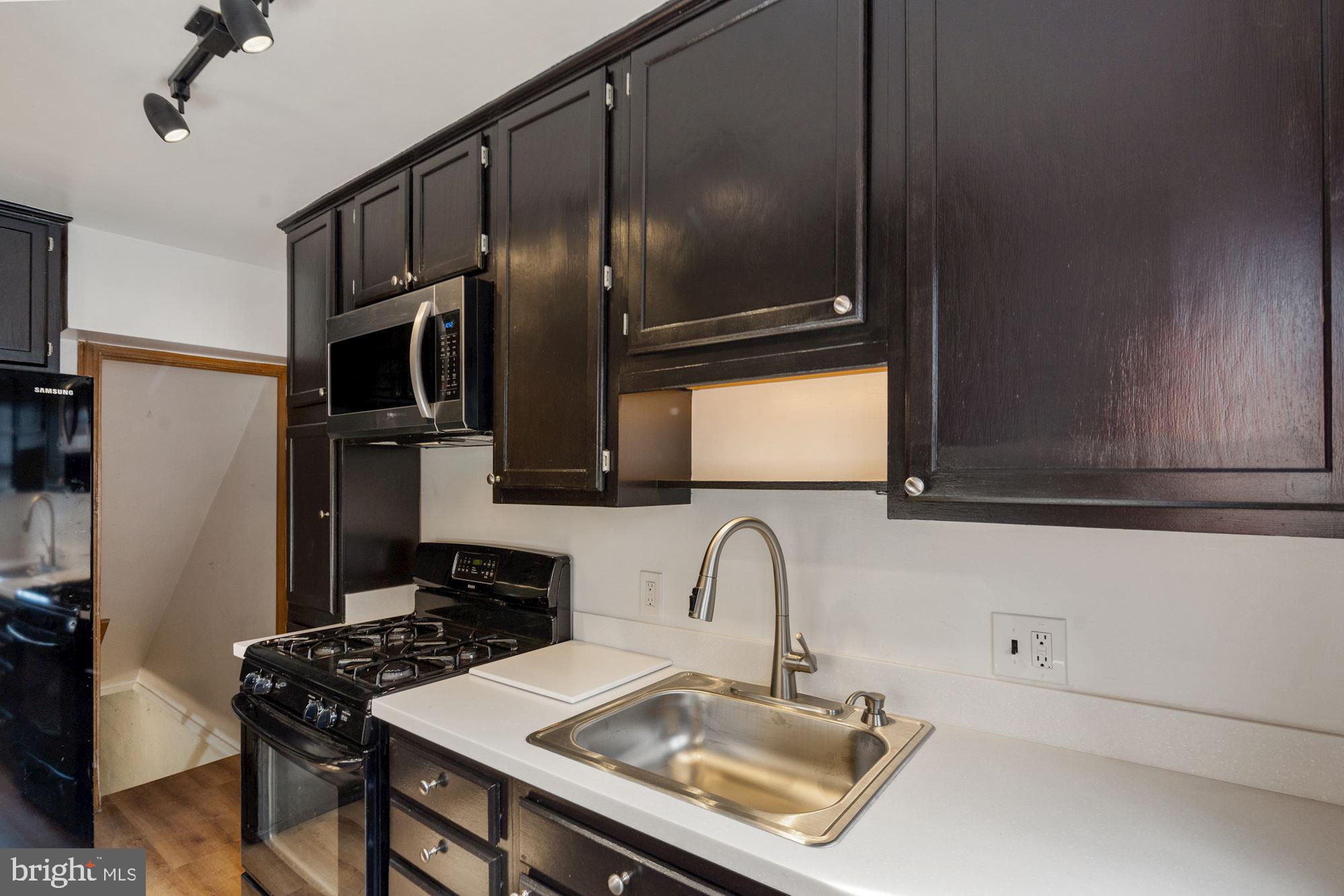 1403 K Street Southeast Washington, DC 20003 - Photo 69 of 74 a kitchen with stainless steel appliances a sink stove and refrigerator