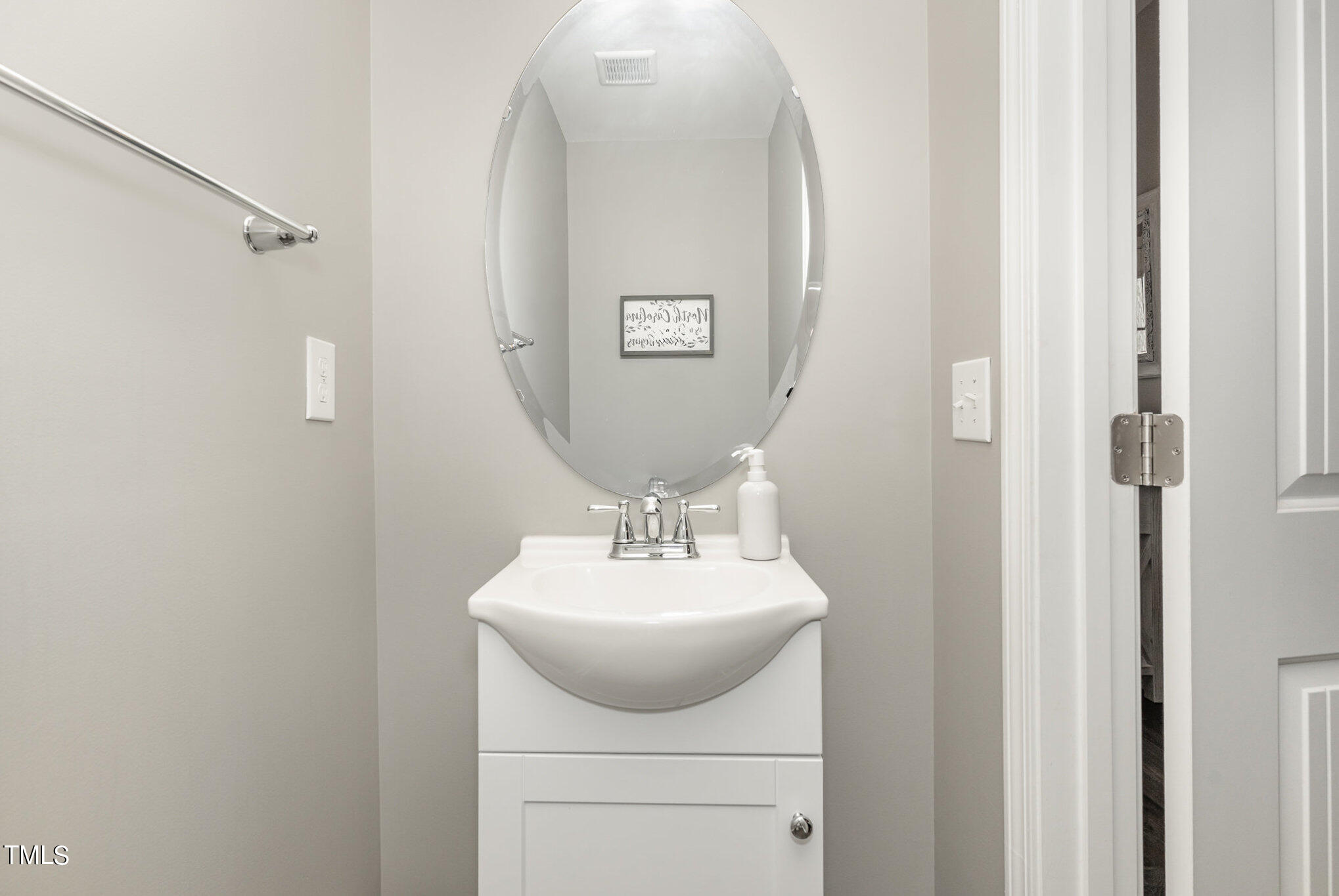 3743 Landshire View Lane Raleigh, NC 27616 - Photo 12 of 28 a bathroom with a sink mirror and vanity